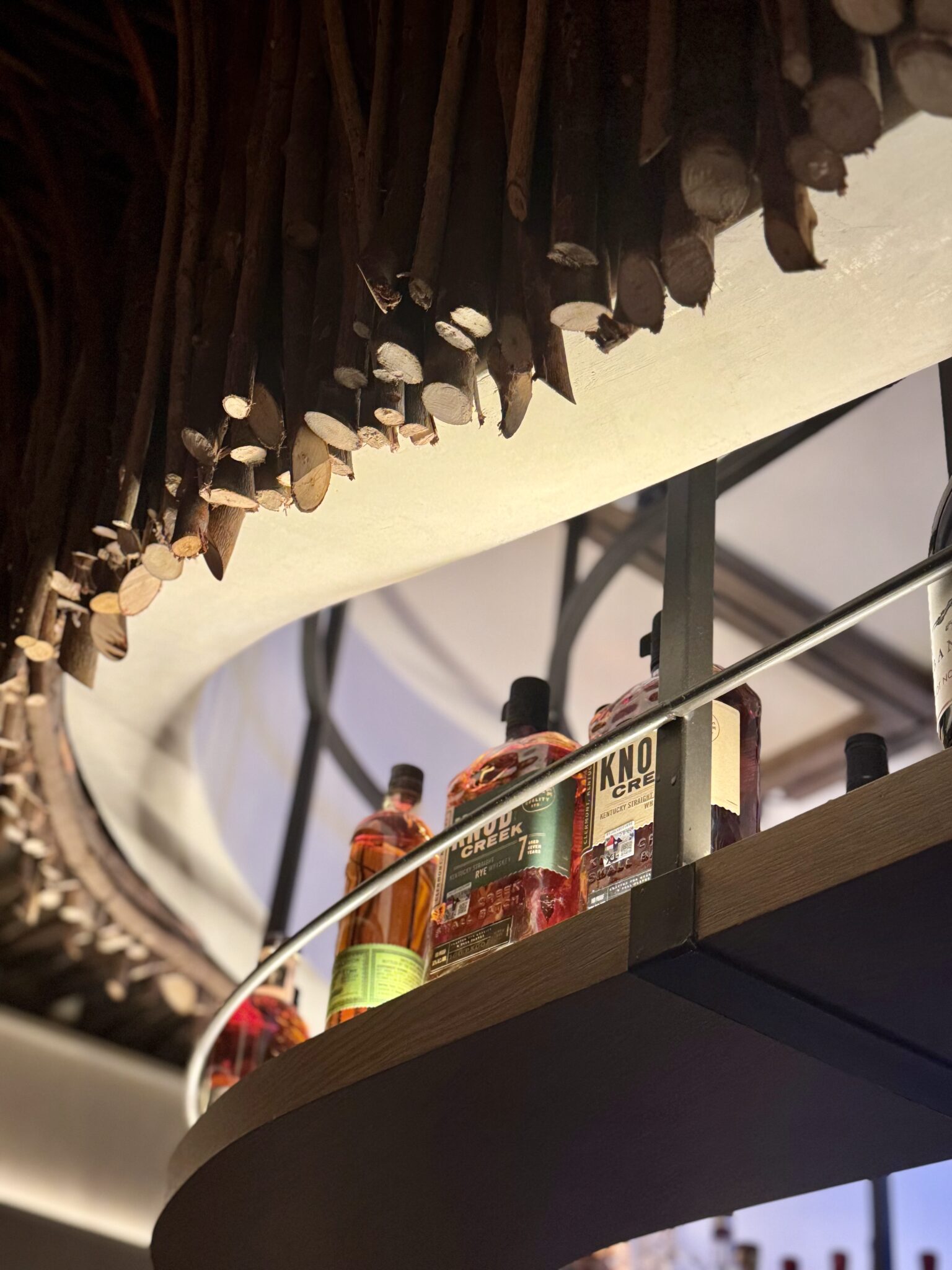 Cocktail served in a rocks glass with citrus garnish, photographed for Mixtropolis article on base spirits in cocktail building.