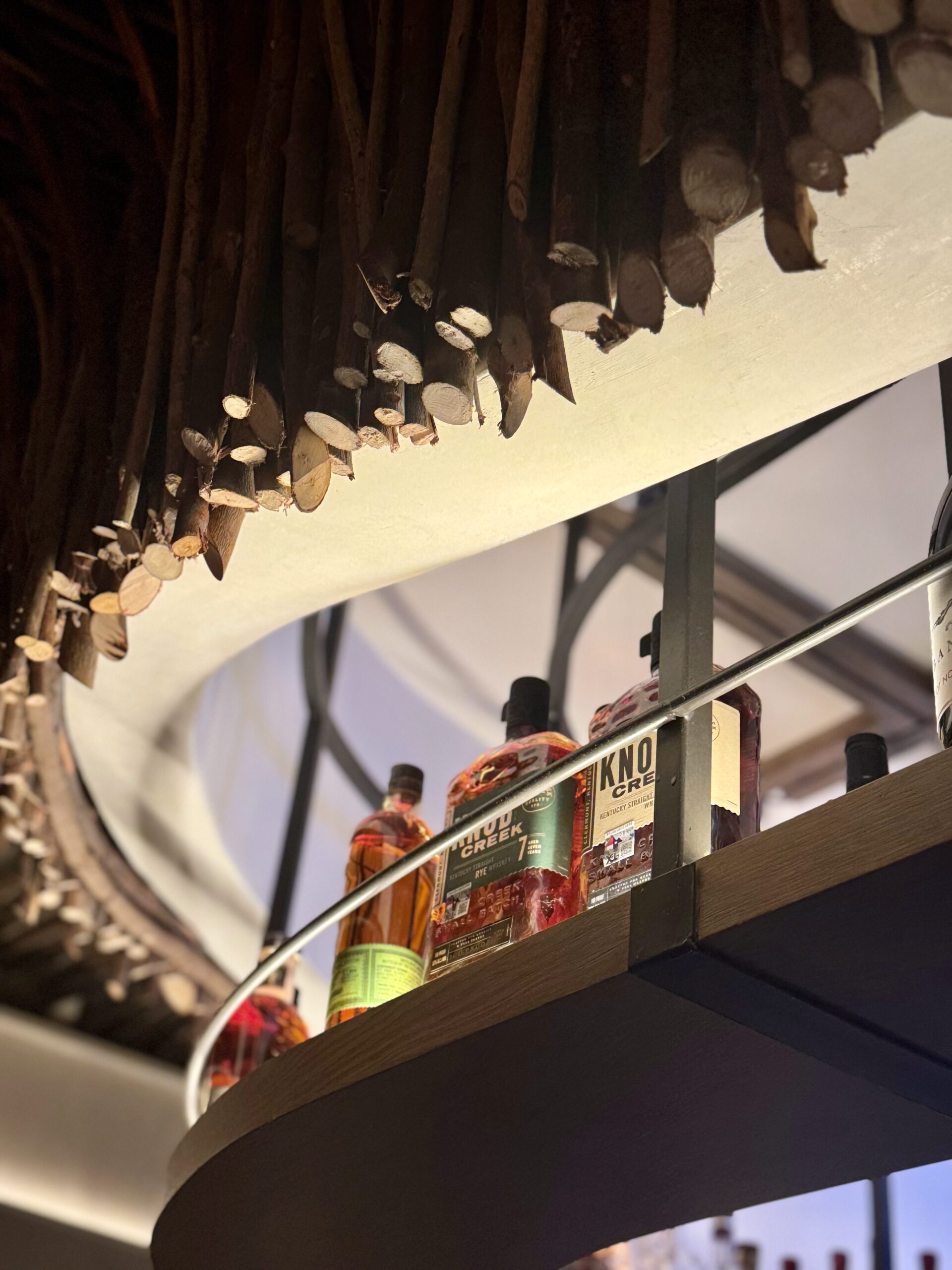 Cocktail served in a rocks glass with citrus garnish, photographed for Mixtropolis article on base spirits in cocktail building.