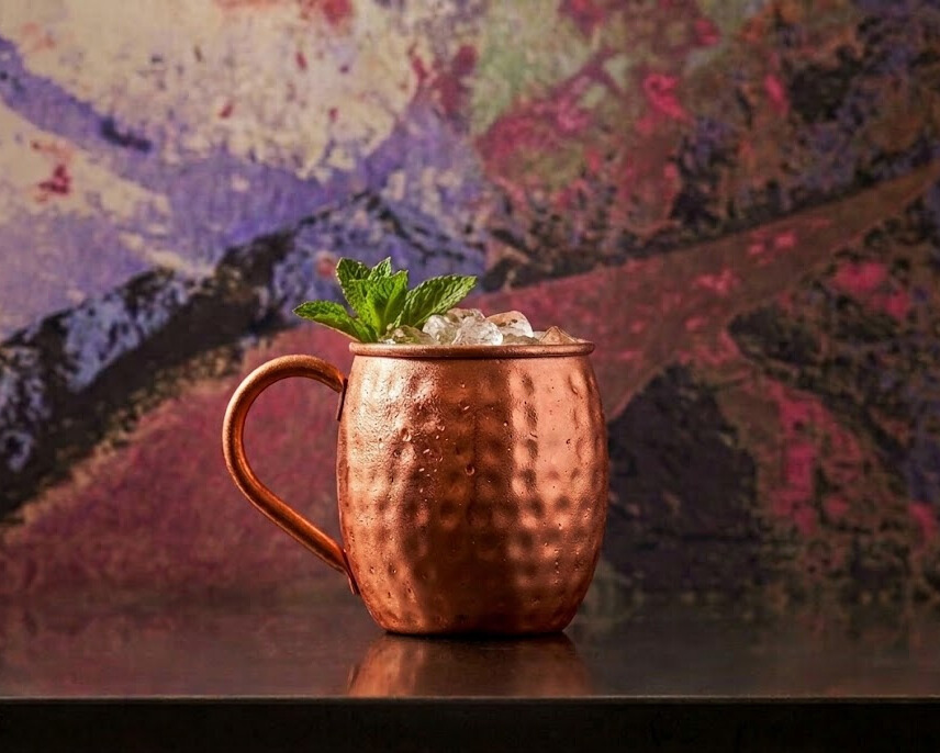 Gin Mule cocktail in a copper mule mug with mint garnish